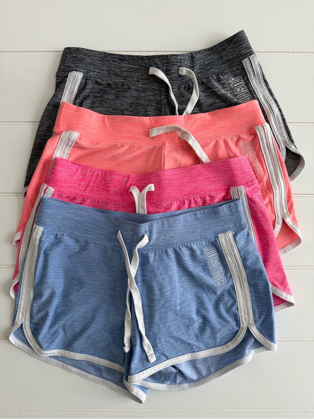 Justice Girls 4 Pairs Active Shorts in Blue, Hot Pink, Coral & Charcoal